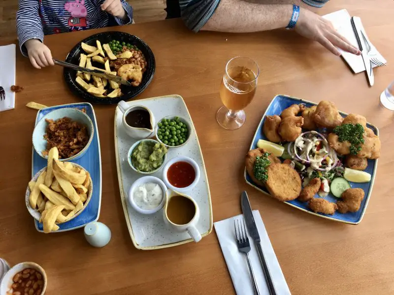 a table with fish and chips from the Upper Deck Fish Restaurant at Flamingo Land