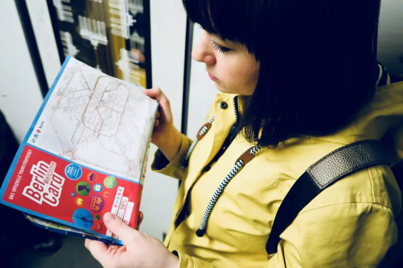 A women reads a welcome card train map