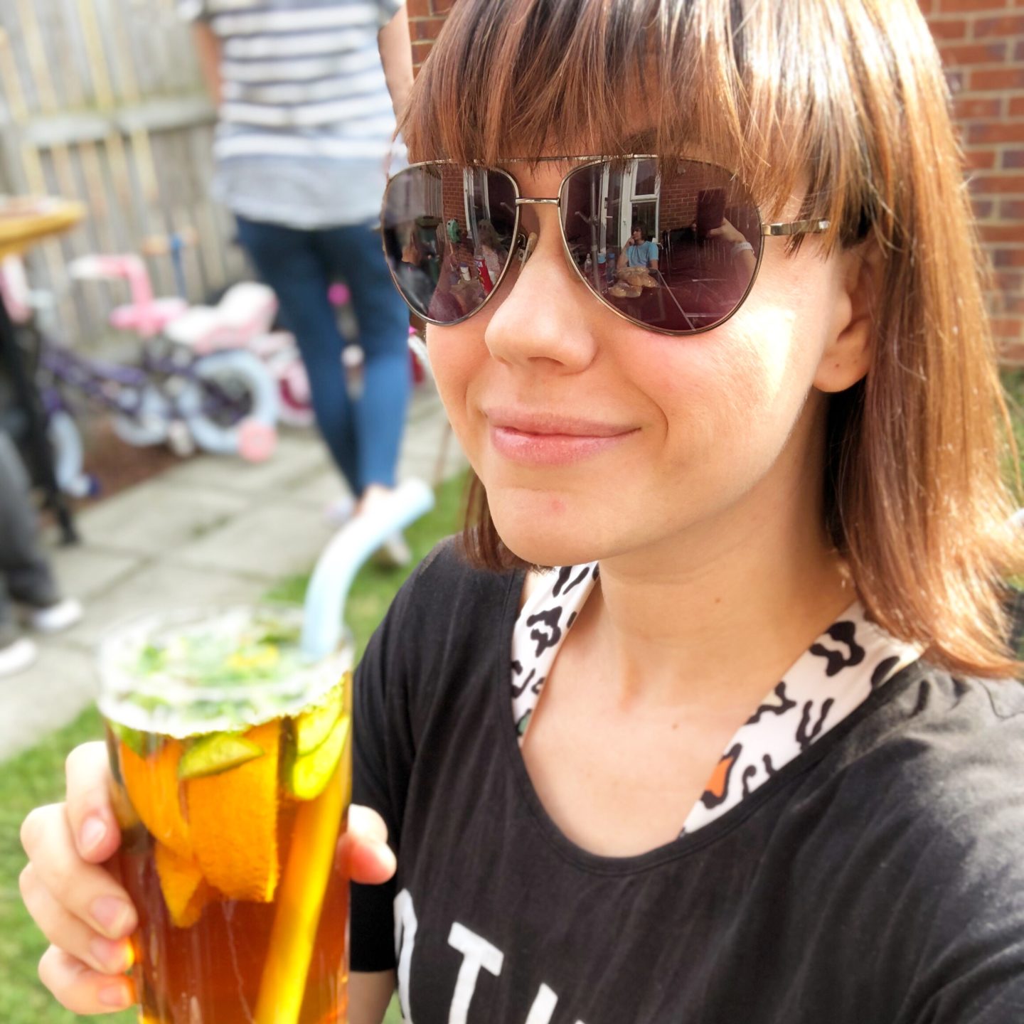 Woman drinking a glass of pimms